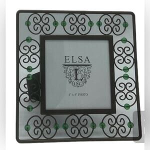 Bronze colored wire double curly heart frame with kelley green glass beads